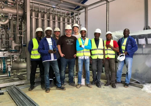 Meyomessala team members in water treatment facility
