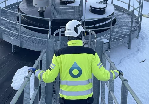 Worker on walkway in biogas plant operations